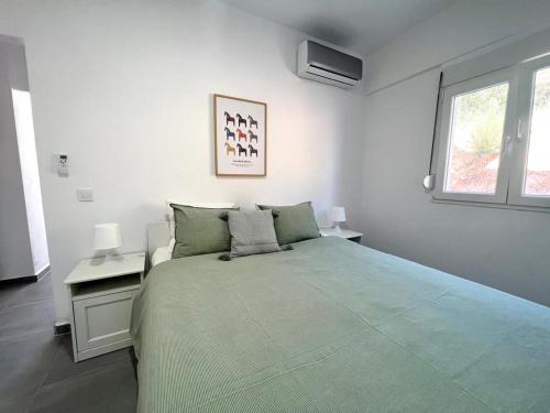 Postel nebo postele na pokoji v ubytování Sithonian suites