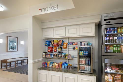 a snack station in a store with a refrigerator at Residence Inn Sandestin at Grand Boulevard in Destin