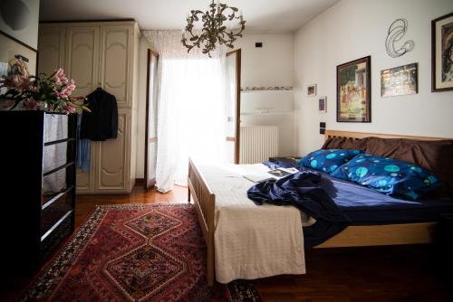 a bedroom with a bed and a rug at Al Parco Storga B&b in Treviso