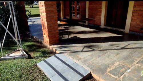 a front porch of a house with a door at Chácara em Boituva com piscina e churrasqueira in Boituva