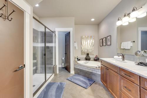 a bathroom with two sinks and a tub and a shower at Donnelly Cabin with Hot Tub Less Than 1 Mi to Boulder Creek! in Donnelly