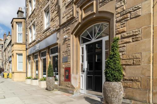 an entrance to a building with a door at PREMIER SUITES Edinburgh Fountain Court in Edinburgh