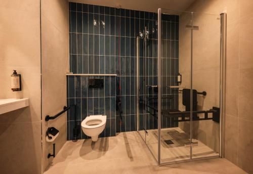 a bathroom with a toilet and a glass shower at Waterford Viking Hotel in Waterford