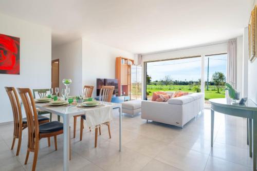 a living room with a table and a couch at Villa Medea in Casarano
