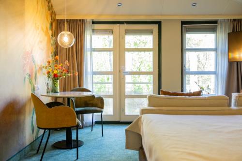 Postel nebo postele na pokoji v ubytování Parkhotel Tjaarda
