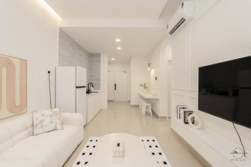 a white living room with a white couch and a tv at [Creamy house KSL 2 JB] #6Pax #Austin #18th floor in Johor Bahru
