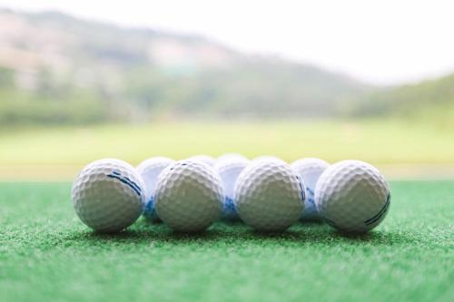 a group of golf balls sitting on the grass at Crowne Plaza Chongqing New North Zone by IHG in Chongqing