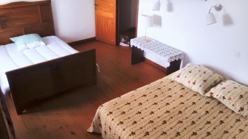 Maison de 4 chambres a Palladuc tesisinde bir odada yatak veya yataklar
