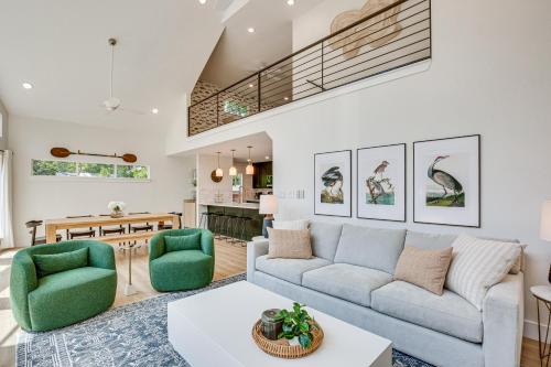 a living room with a couch and two chairs at Dock and Fire Pit Lakefront Home in Malakoff! in Malakoff