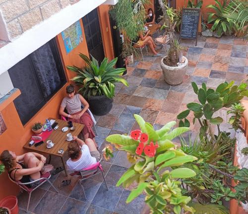 a group of people sitting at a table in a restaurant at El Ultimo Maya in Akumal