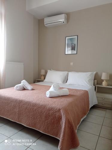 a bedroom with two towels on a bed at Domina Villas in Almyrida