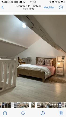 a bedroom with a bed in an attic at Propriete d'une chambre avec vue sur la ville et wifi a Neauphle le Chateau in Neauphle-le-Château