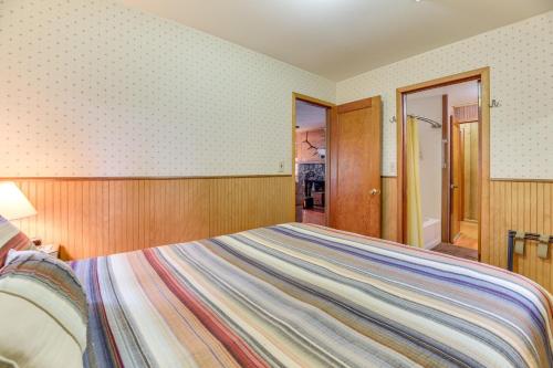 a bedroom with a large bed in a room at Waterfront Grapeview Escape with Boat Dock and Views! in Grapeview