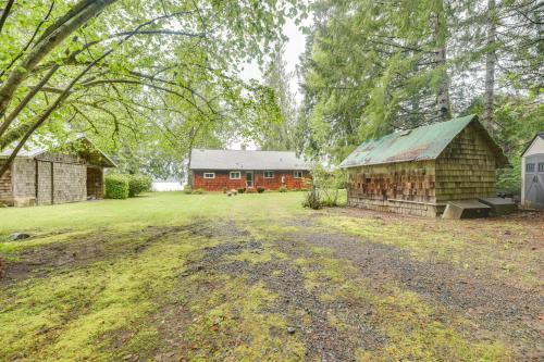 a large yard with two buildings and a barn at Waterfront Grapeview Escape with Boat Dock and Views! in Grapeview