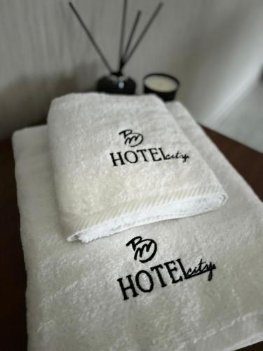 two towels with the words no hotel on them at BM HOTEL City in Samsun