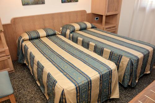 Postel nebo postele na pokoji v ubytování Hotel Thàlas Club