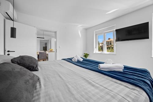 Ένα ή περισσότερα κρεβάτια σε δωμάτιο στο Apartment Lauro - amazing sea view !