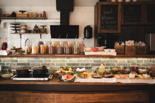 a kitchen with a buffet of food on a counter at Två Systrar B&B in Skurup
