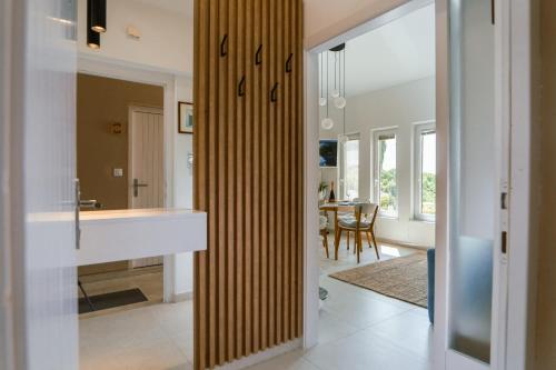 a kitchen with a large wooden partition in a house at la belavista in Izola