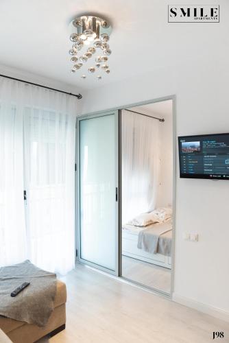 Cama ou camas em um quarto em Smile Apartments