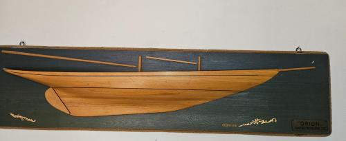 a painting of a wooden boat on a wall at "A Ridosso" sul mare nel cuore del paese in Le Grazie