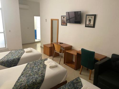 TV a/nebo společenská místnost v ubytování Hotel Miramar