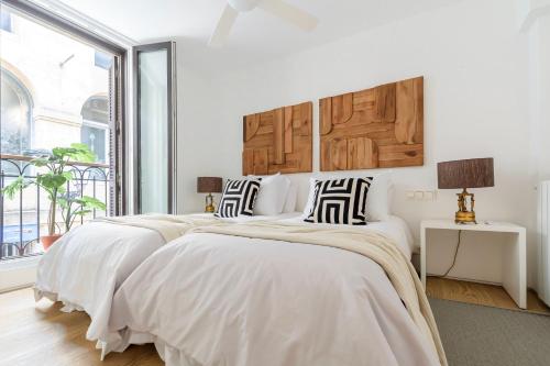 A bed or beds in a room at 8 balconies Heart of the old town