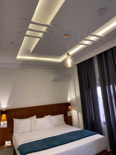 Postel nebo postele na pokoji v ubytování Hôtel TAZ PLUS