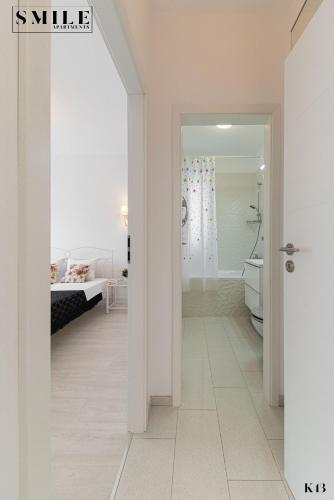 Cama ou camas em um quarto em Smile Apartments