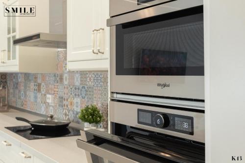 A cozinha ou cozinha compacta de Smile Apartments