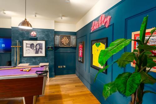 a billiard room with a pool table in it at City Retreat, Spacious 4 Bed House, Games Room, Parking, Hot Tub & BBQ in Cardiff