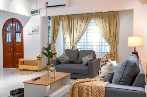 a living room with a couch and a table at New!14pax,Petaling Jaya Damansara Landed Home next Starling Atria Mall 1U IKEA in Petaling Jaya