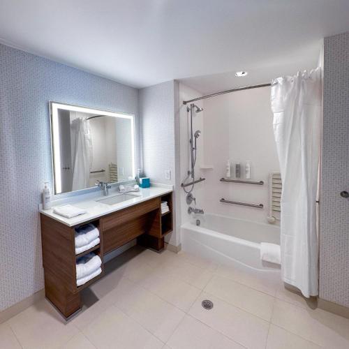 a bathroom with a sink and a shower at Home2 Suites by Hilton Fort Walton Beach Eglin AirForce Base in Fort Walton Beach