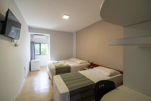 Ένα ή περισσότερα κρεβάτια σε δωμάτιο στο Lagoa Park Hotel