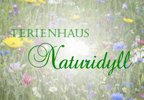 a field of flowers with the words enermis nautilus at Ferienhaus Falkenhagen mit Garten in Pachthof