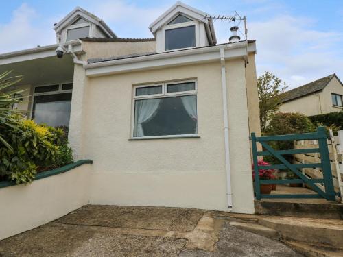 a house with a green gate in front of it at Harbour High Annex in Fishguard