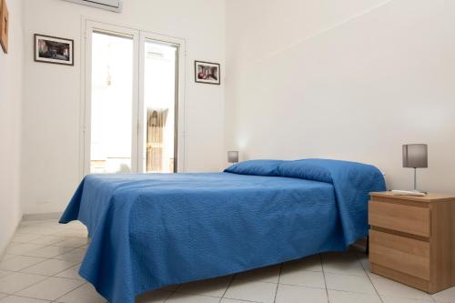 Posteľ alebo postele v izbe v ubytovaní Appartamento Eva