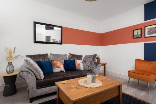 a living room with a couch and a table at Hill Lane in Central Manchester - Free Parking in Manchester