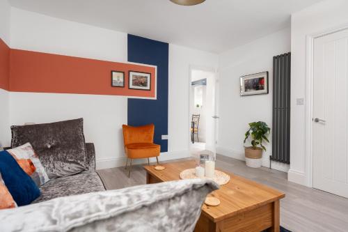 a living room with a couch and a table at Hill Lane in Central Manchester - Free Parking in Manchester