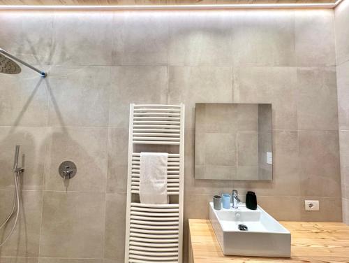 a bathroom with a sink and a shower at Villa Ginevra Resort Agrituristico in Ficarra