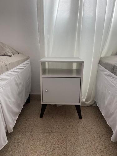 Ein Bett oder Betten in einem Zimmer der Unterkunft Habitaciones privadas en un departamento encantador