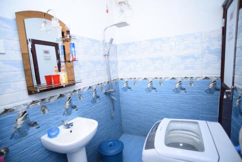 a bathroom with a sink and ducks in the water at Suriya Ocean Villa in Wadduwa