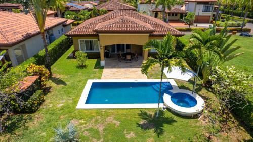 an aerial view of a house with a swimming pool at Villa Arrecife By Vacation Pura Vida in Bejuco