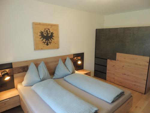 Postel nebo postele na pokoji v ubytování Bacher´s Home am Sonnenplateau