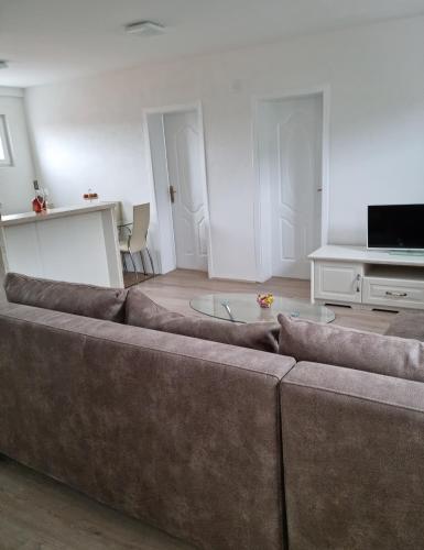 a living room with a couch and a table at Nada-S in Soko Banja
