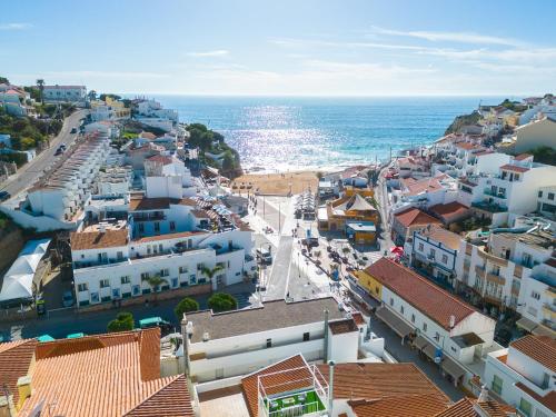 an aerial view of a town next to the ocean at Apartment Carvoeiro By The Sea 1 by Algarve Vacation in Carvoeiro
