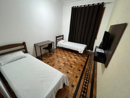 Postel nebo postele na pokoji v ubytování Hotel Barroco