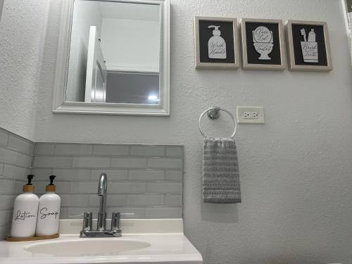 a bathroom with a sink with a mirror and a towel at Haven of peace Studio in Lakeland