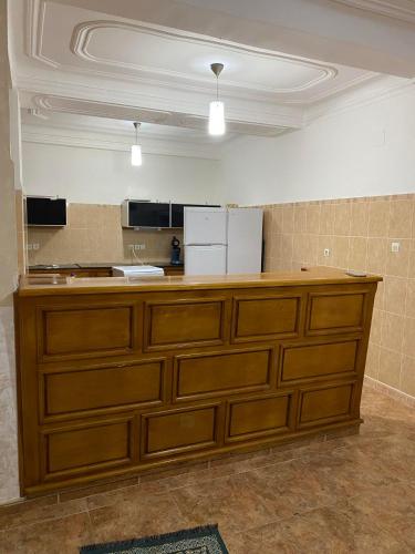 a kitchen with a large wooden counter top at villa vue mer plage sghirat in Benhammouch