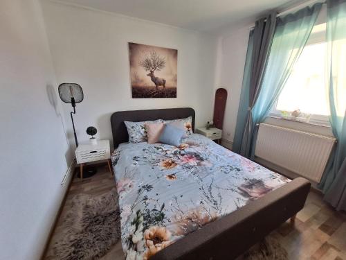 a bedroom with a bed with a deer on it at Hellen Studio Predeal in Predeal